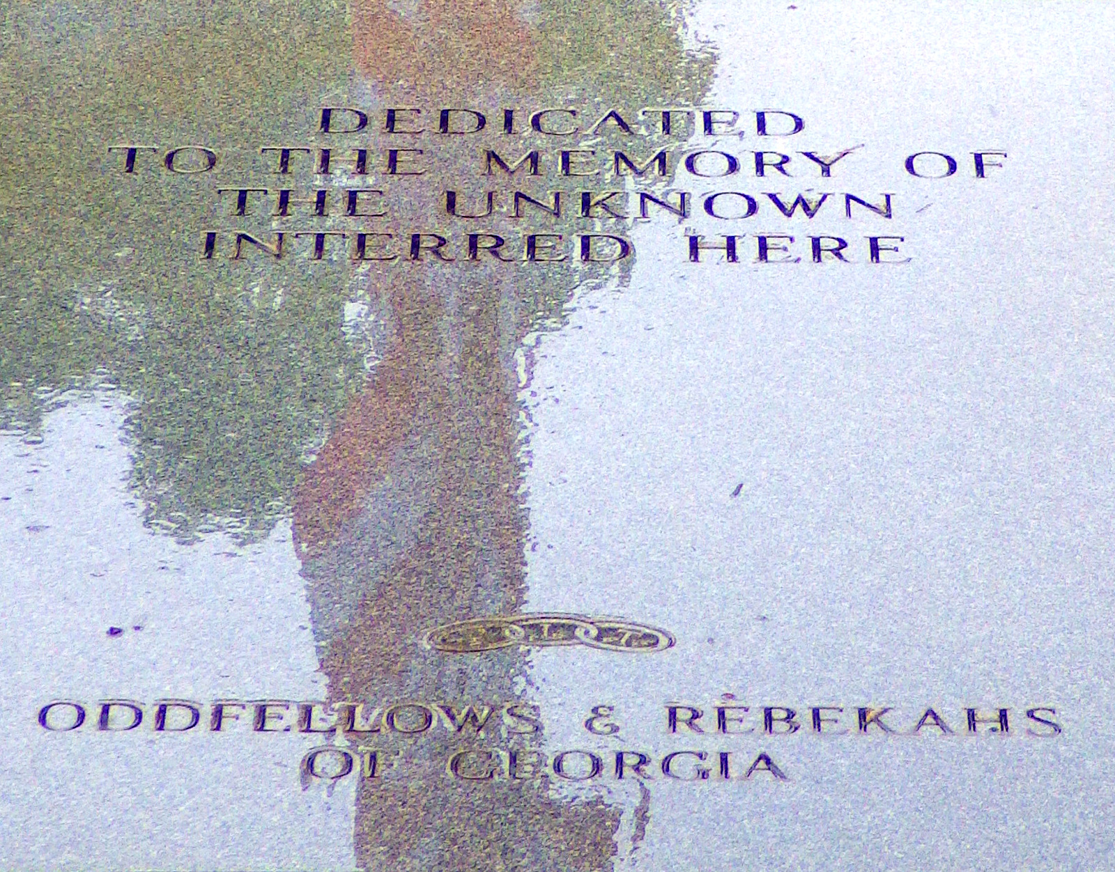 Reflection of the American flag on the tomb of the unknown