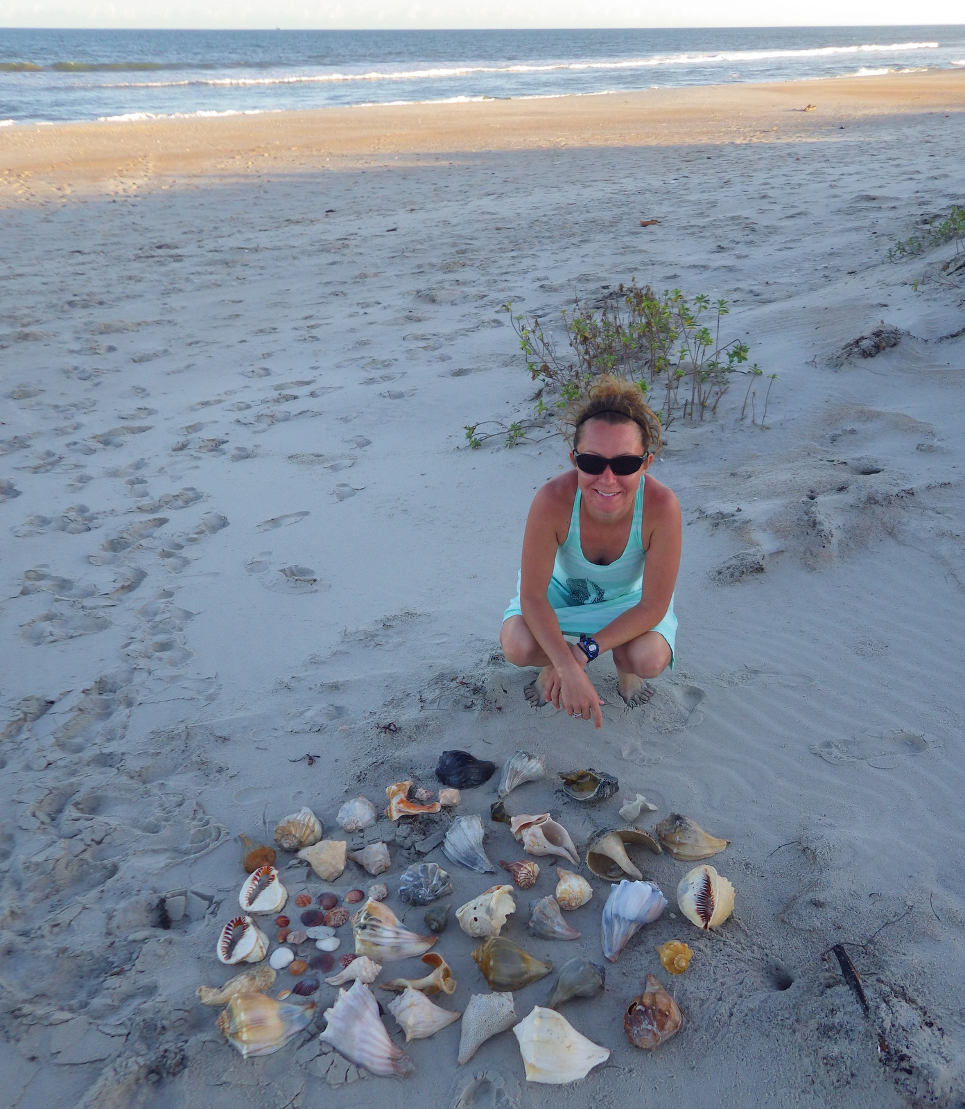 Tiff with her collection of shells she found